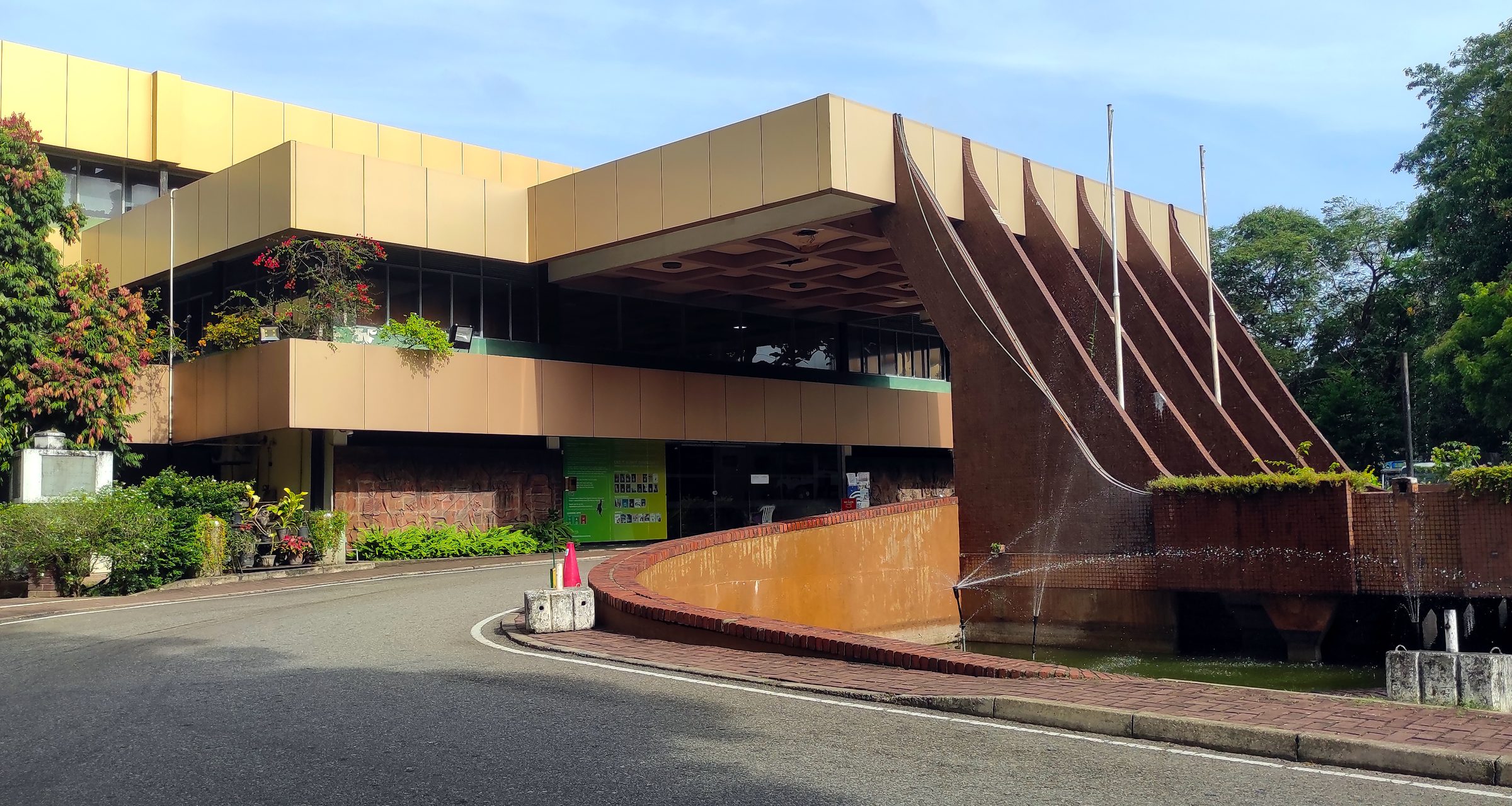 A low modern library with deep concrete fins along its facade